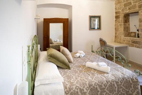 Postel nebo postele na pokoji v ubytování Corte Pietrantica - Charming Rooms & Suites