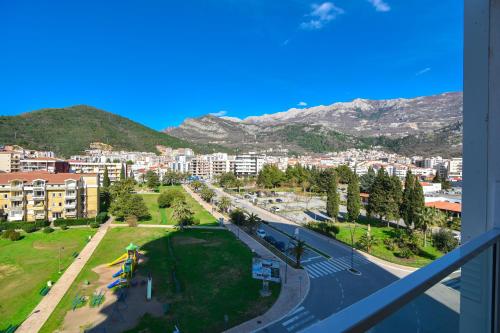 a view of a city from a balcony at Apartments Menuet in Budva