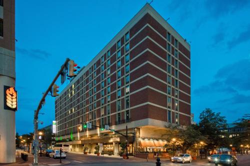 a tall building on a city street with a traffic light at Holiday Inn Lancaster by IHG in Lancaster