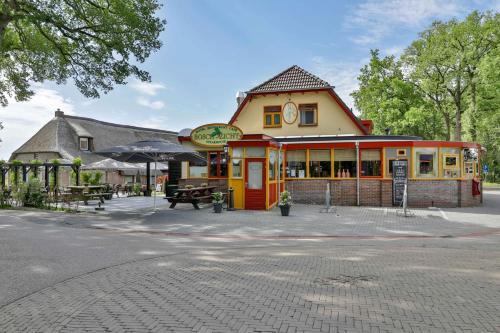 a building with a clock on top of it at Boschzicht in Echten