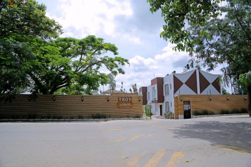 a wooden fence in front of a building at Troy Lodge in Lusaka