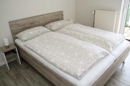 En eller flere senge i et værelse på Apartment am Hütteberg