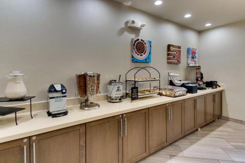 a kitchen with a counter with many appliances on it at Staybridge Suites Missoula by IHG in Missoula