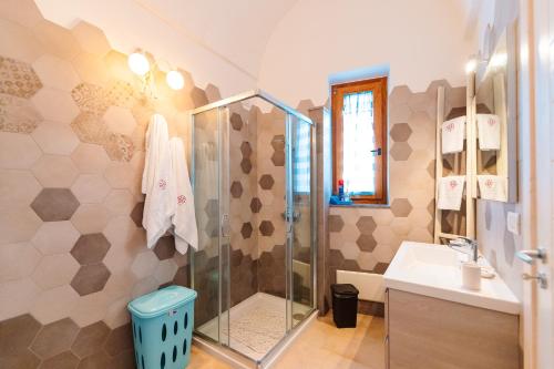 a bathroom with a shower and a sink at Iolanda Vacanze in Lucugnano
