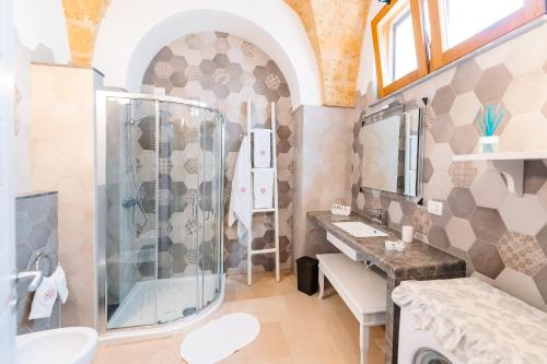 a bathroom with a shower and a sink at Iolanda Vacanze in Lucugnano