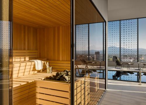 a spa room with a view of the city at InterContinental - Ljubljana by IHG in Ljubljana