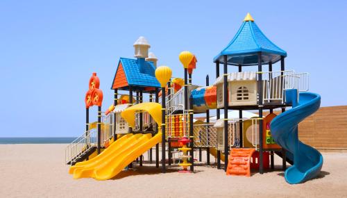a playground on the beach with a slide at InterContinental Aqaba by IHG in Aqaba