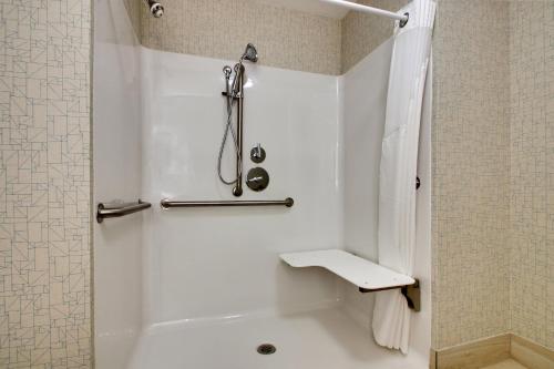 a white bathroom with a shower and a toilet at Holiday Inn Express & Suites Mt Sterling North by IHG in Mount Sterling