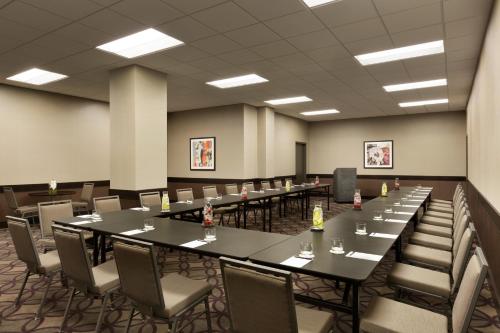 a conference room with long tables and chairs at InterContinental St. Paul Riverfront by IHG in Saint Paul