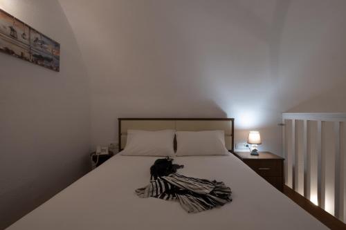 Una cama o camas en una habitación de Mare Nostrum Santo