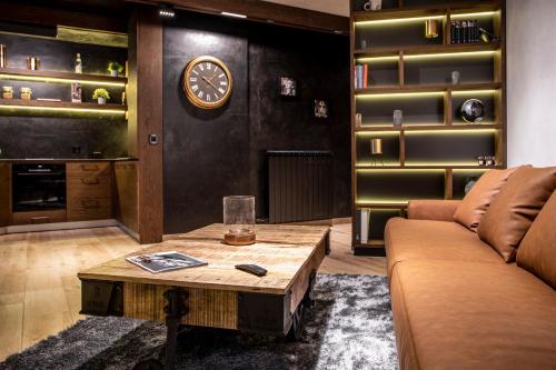 a living room with a couch and a table at Bella Roe Premium Apartments in Belgrade