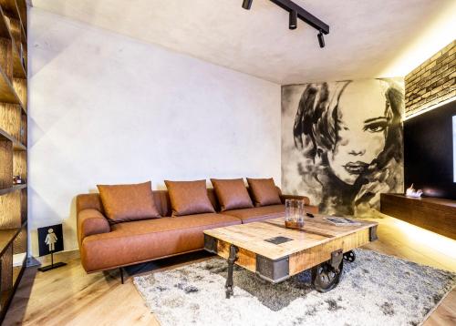 a living room with a couch and a table at Bella Roe Premium Apartments in Belgrade