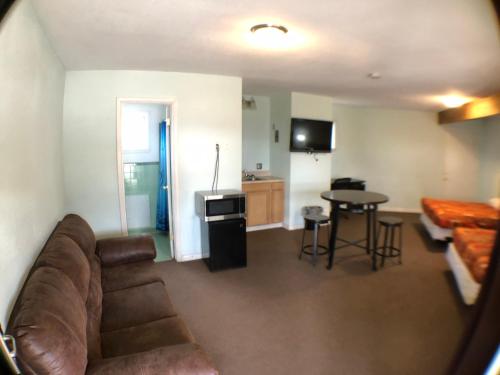 a living room with a couch and a table at Tower 64 Motel & RV in Trinidad