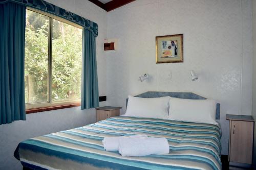 Krevet ili kreveti u jedinici u okviru objekta Rivergardens Holiday Park Mildura