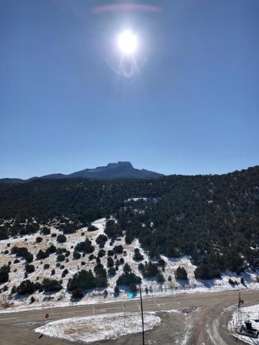 a view of a dirt road with the sun in the sky at Tower 64 Motel & RV in Trinidad