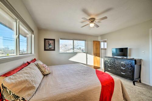 a bedroom with a bed and a ceiling fan at Family-Friendly Cortez Cedar House with Yard! in Cortez