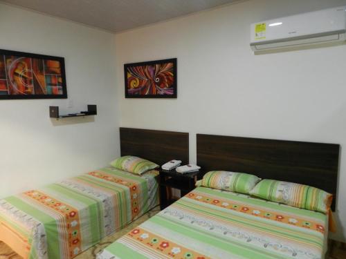 Postel nebo postele na pokoji v ubytování Hotel Sucre Del Bosque
