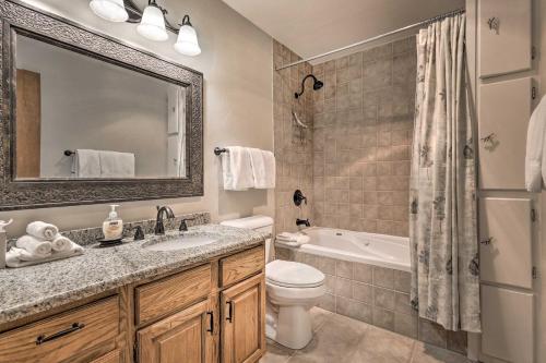 a bathroom with a sink and a toilet and a tub at Eclectic Eagle-Vail Condo 2 Miles to Beaver Creek in Beaver Creek