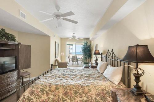a bedroom with a bed and a ceiling fan at Dunes of Seagrove Condominiums in Seagrove Beach