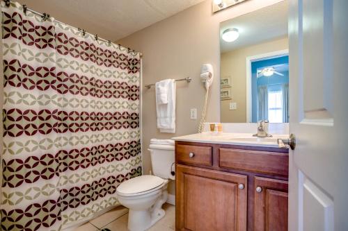 a bathroom with a toilet and a sink at Seychelles Beach Resort IV in Panama City Beach