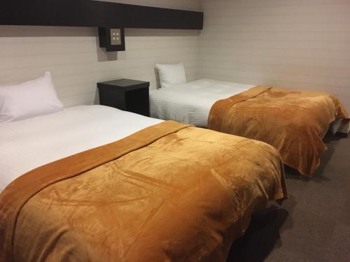 Llit o llits en una habitació de Green Rich Hotel Hamada Ekimae (Artificial hot spring Futamata Yunohana)