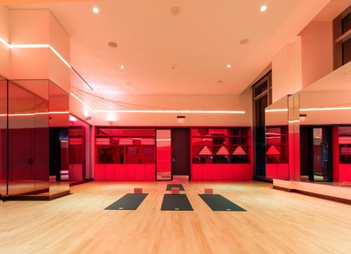 a gym with yoga mats in the middle of a room at InterContinental - Los Angeles Downtown by IHG in Los Angeles
