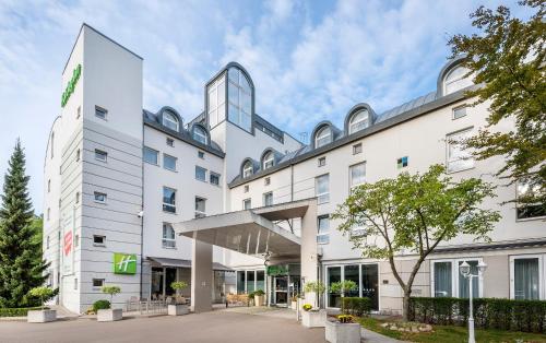 a rendering of the front of a hotel at Holiday Inn Lübeck, an IHG Hotel in Lübeck