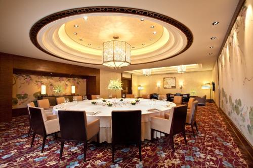 a large dining room with a large table and chairs at InterContinental Wuxi by IHG in Wuxi