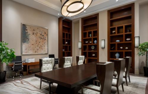 a dining room with a table and chairs at InterContinental Kunming by IHG in Kunming