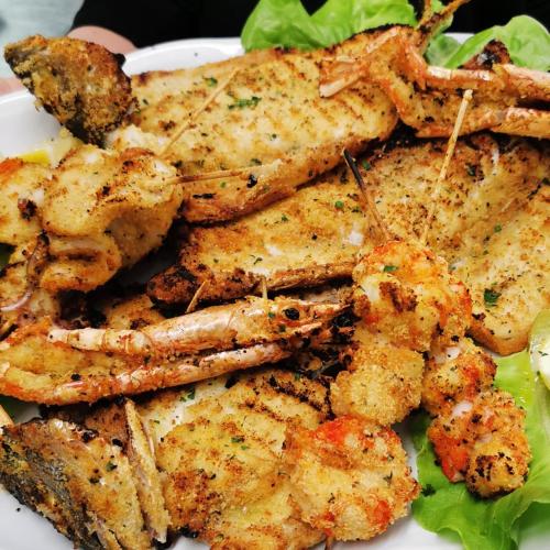 a white plate of food with shrimp and lettuce at Rosa Dei Venti in Lugo