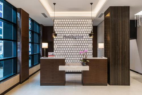 a bathroom with a sink and a wall of windows at Holiday Inn Brooklyn Downtown by IHG in Brooklyn
