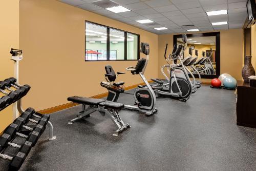 a gym with several treadmills and exercise bikes at Holiday Inn Wichita East I-35 by IHG in Wichita