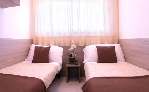 Letto o letti in una camera di Internazionale - Family Village