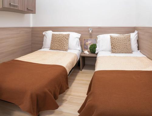 Letto o letti in una camera di Internazionale - Family Village