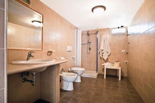 a bathroom with a sink and a toilet at Felicity Vieste in Vieste