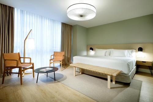 Postel nebo postele na pokoji v ubytování Barceló Oviedo Cervantes