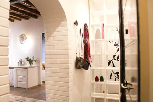 a room with a hallway with white walls and a closet at Chilling'Monti in Rome