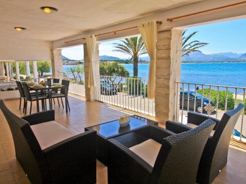 a dining room with a view of the water at Apartment Voramar by Interhome in Alcudia