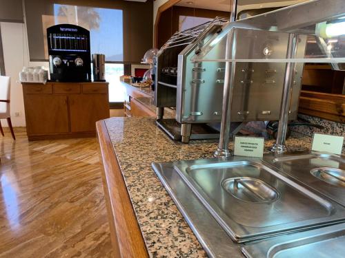 a kitchen with a counter with a toaster oven at Hotel Royal Plaza in Ibiza Town