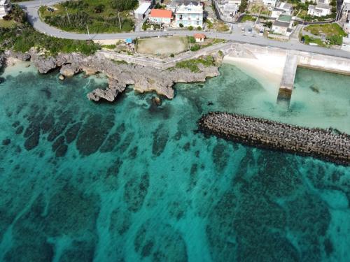 an aerial view of a beach and the ocean at Crystal Villa ikema in Miyako Island