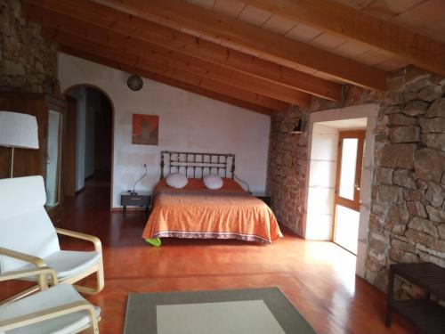 En eller flere senge i et værelse på Lujosa casa mallorquina restaurada "Es carrero"