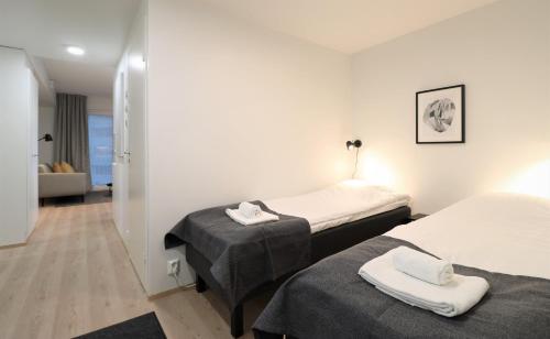 Ένα ή περισσότερα κρεβάτια σε δωμάτιο στο Forenom Aparthotel Tampere Kaleva