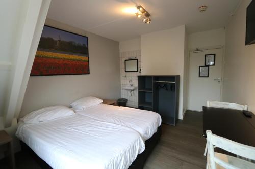 Una cama o camas en una habitación de Hotel Hortus
