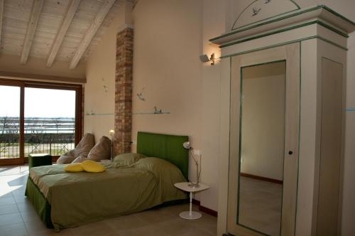 Postel nebo postele na pokoji v ubytování Agriturismo La Barena
