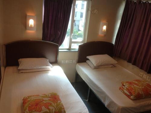 Postel nebo postele na pokoji v ubytování Hong Kong CoLiving Space
