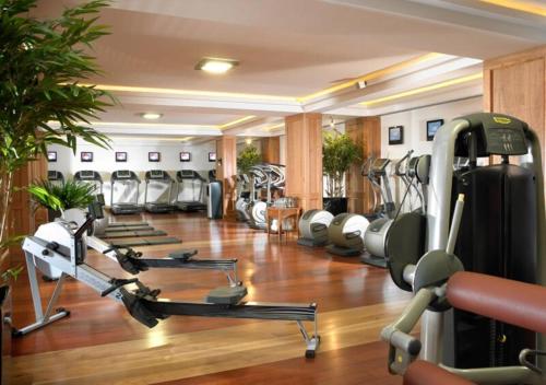a gym with several treadmills and cardio machines at Garryvoe Hotel in Ballycotton