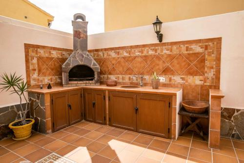 a kitchen with a sink and an oven in it at La Maison de la Plage, by Comfortable Luxury in Corralejo