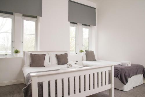 Ένα ή περισσότερα κρεβάτια σε δωμάτιο στο TLK Apartments & Hotel - Beckenham Junction