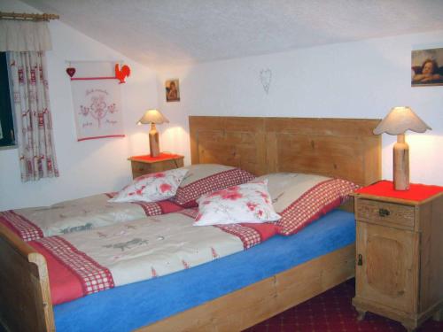 a bedroom with a bed with two pillows on it at Ferienhaus Baumann in Neukirchen beim Heiligen Blut