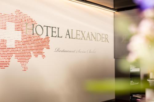 a sign on a wall with the words utel alameda at Hotel Alexander in Basel